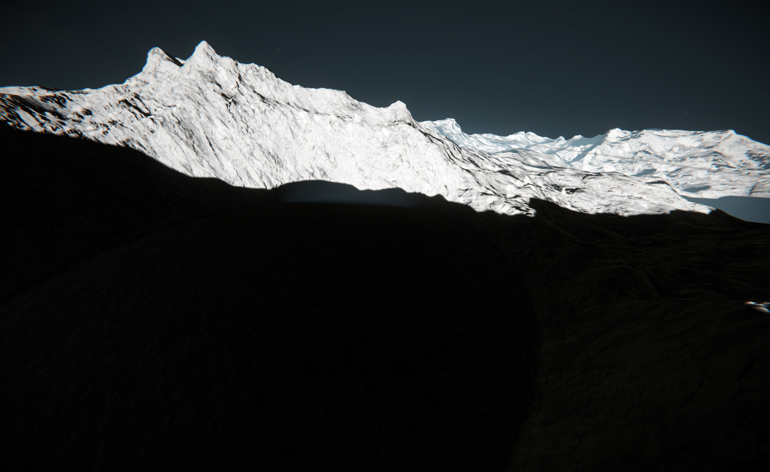 Sunlit white mountain ridges above deep shadow at Capture Zone G3 on Object-85